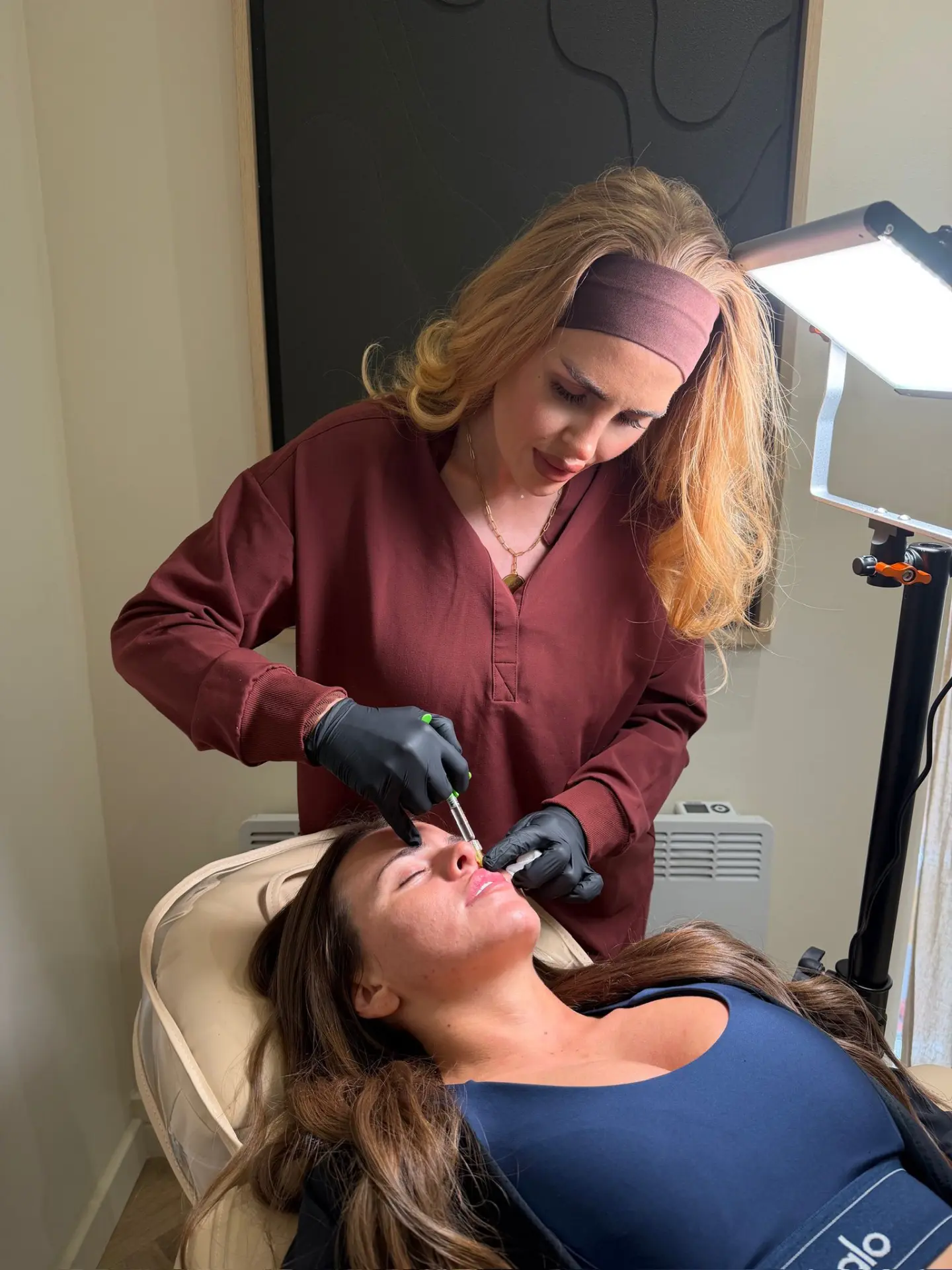 Sophia performing an aesthetic consultation and treatment