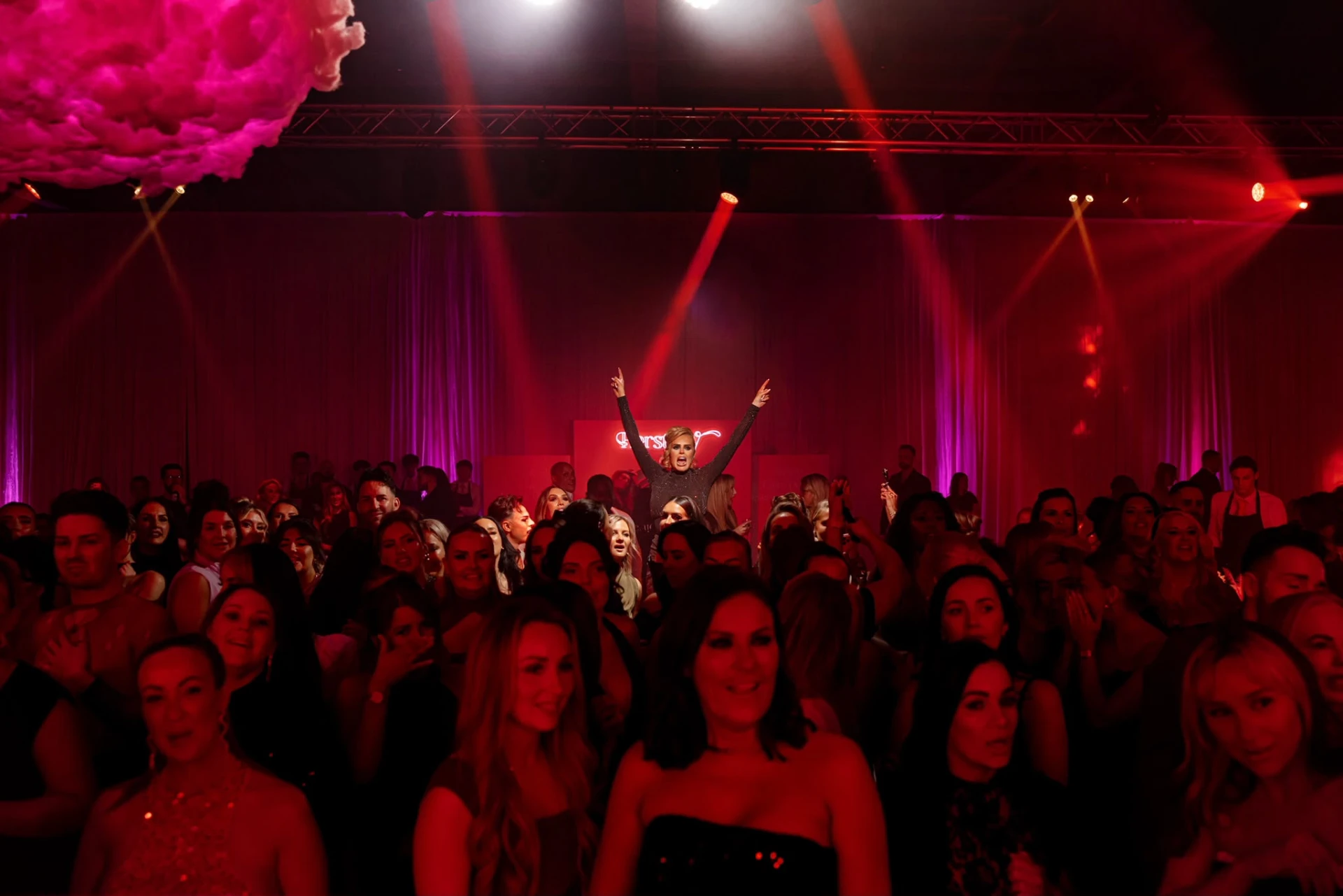 Sophia on stage at Herstory conference with the crowd
